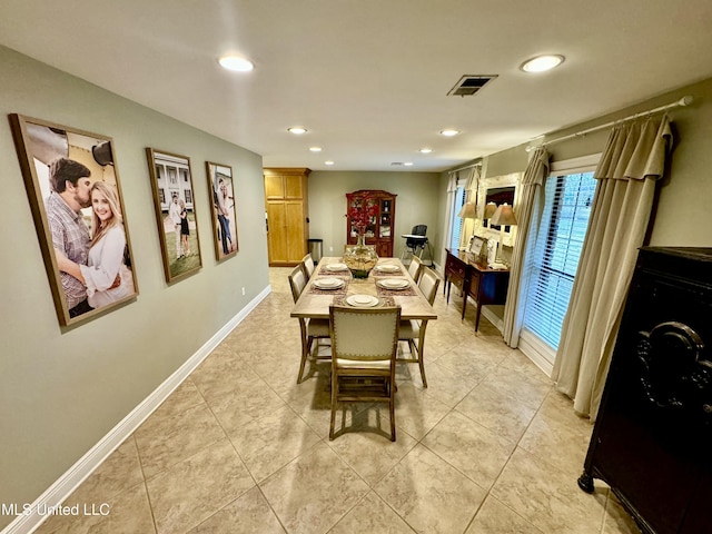 dining space with light tile patterned floors, visible vents, baseboards, and recessed lighting