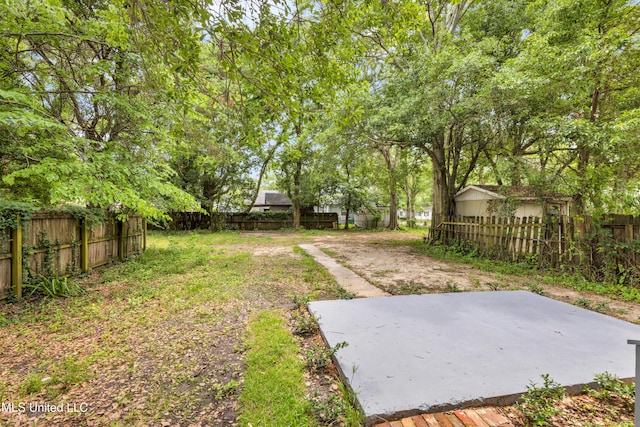 fenced backyard featuring a patio