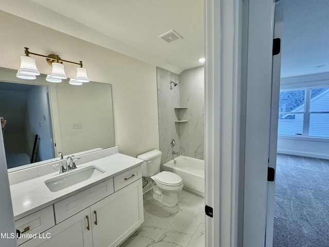 full bathroom with vanity, tiled shower / bath combo, and toilet