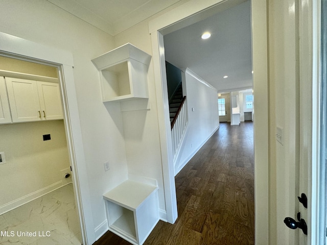 hallway featuring hardwood / wood-style floors and ornamental molding