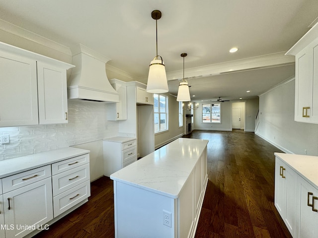 kitchen with white cabinets, ceiling fan, dark wood-type flooring, and hanging light fixtures