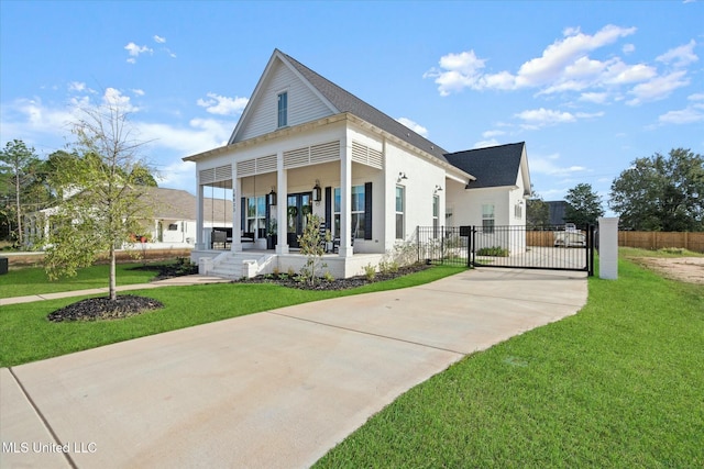 view of front facade with a front lawn and a porch