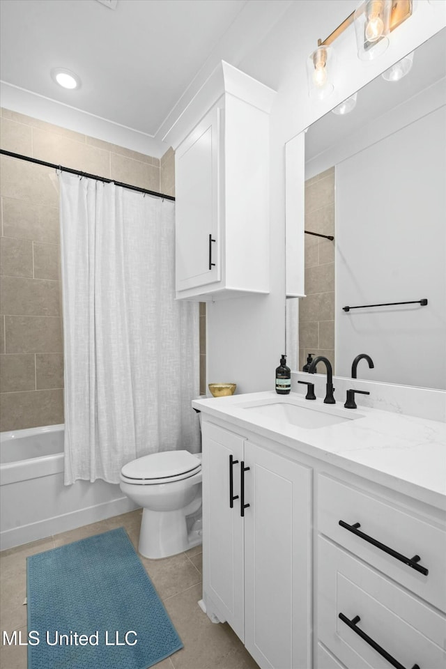 full bathroom featuring toilet, vanity, tile patterned floors, and shower / bathtub combination with curtain