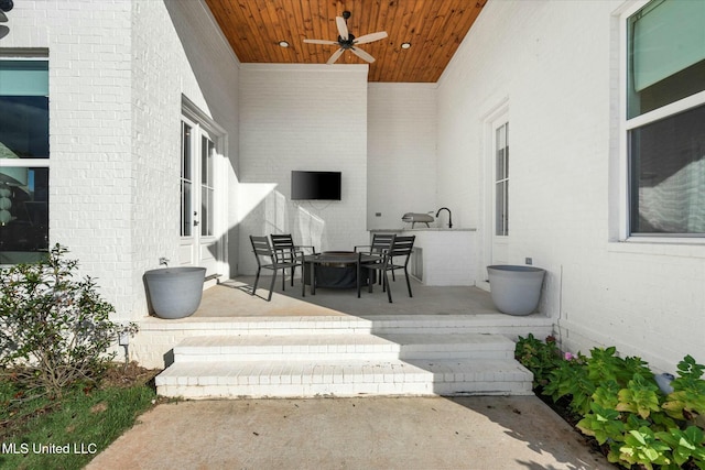 wooden deck with ceiling fan