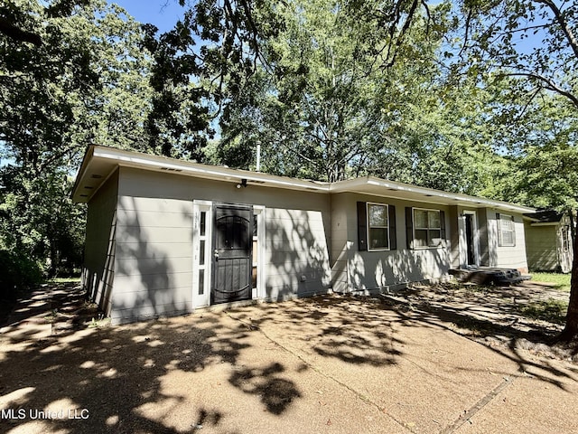 view of front of property featuring concrete block siding
