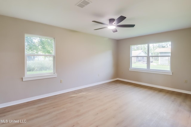 392 Lawler Ave, Long Beach, MS 39560 - empty room featuring light wood-type flooring, a ceiling fan, and baseboards