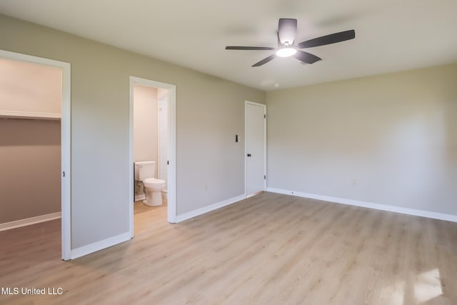 392 Lawler Ave, Long Beach, MS 39560 - unfurnished bedroom with a spacious closet, light wood-style flooring, a closet, and baseboards