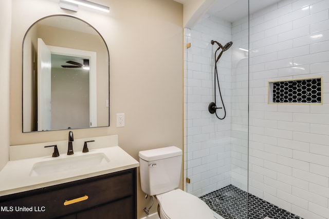 392 Lawler Ave, Long Beach, MS 39560 - full bathroom with vanity, toilet, and a tile shower