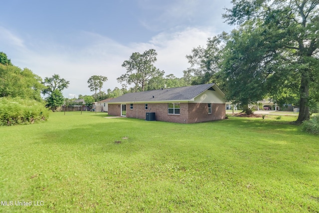 392 Lawler Ave, Long Beach, MS 39560 - rear view of property with a yard, central AC, and brick siding