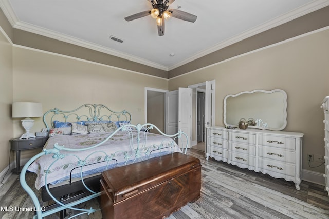 21 Oak Alley Ln, Long Beach, MS 39560 - bedroom with wood finished floors, ornamental molding, baseboards, and a ceiling fan