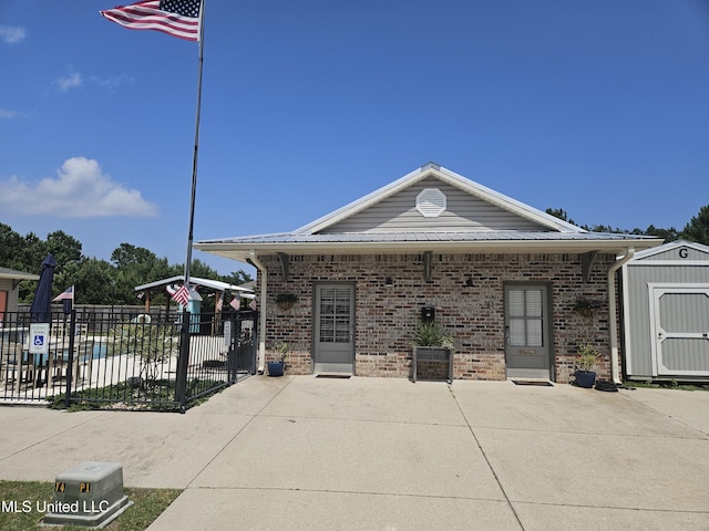 21 Oak Alley Ln, Long Beach, MS 39560 - view of front of home with brick siding and a patio area