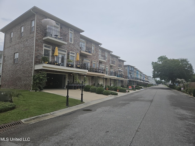 21 Oak Alley Ln, Long Beach, MS 39560 - view of building exterior featuring a residential view and a garage