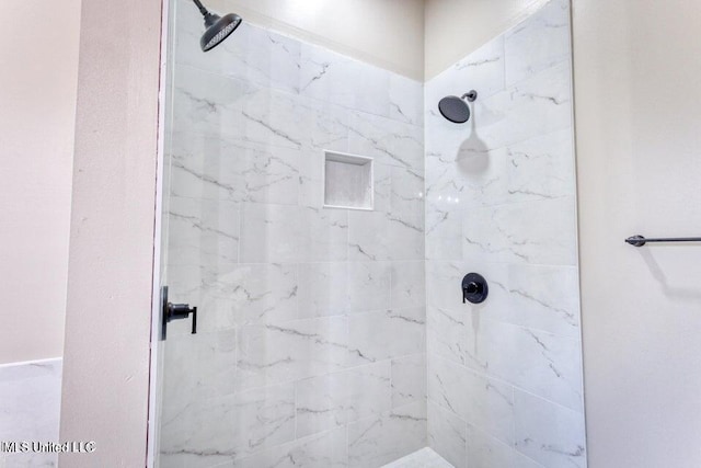 bathroom with tiled shower