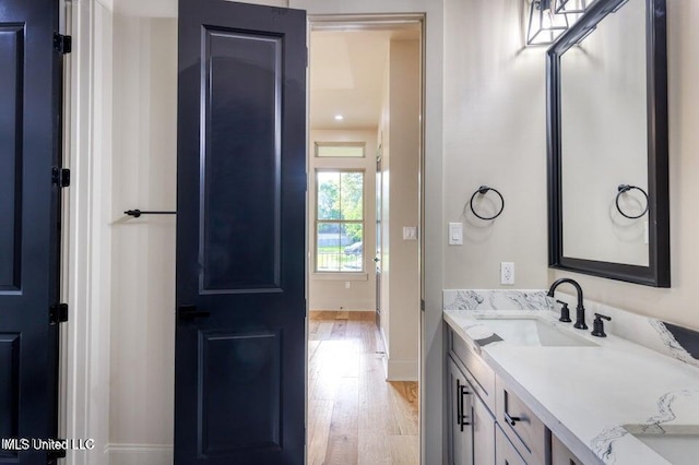 bathroom with vanity and hardwood / wood-style floors