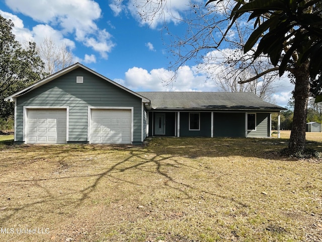 single story home featuring a garage and a front lawn