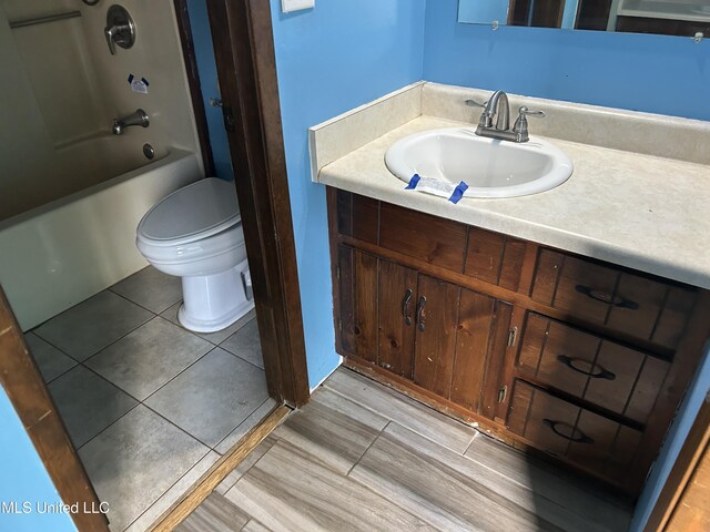 5909 Waltman Rd, Vancleave, MS 39565 - full bathroom with shower / tub combination, vanity, toilet, and tile patterned flooring