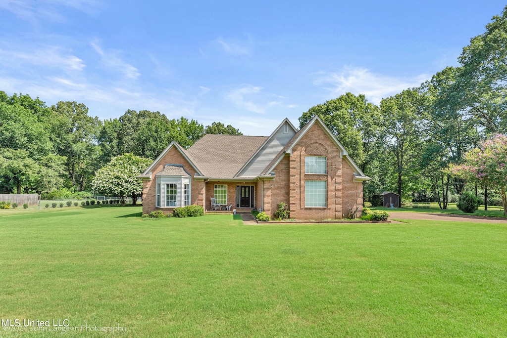 craftsman-style house with a front yard