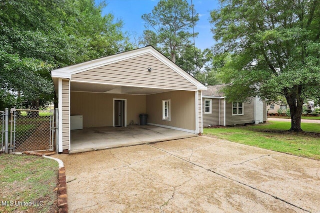 exterior space featuring a front lawn and a carport