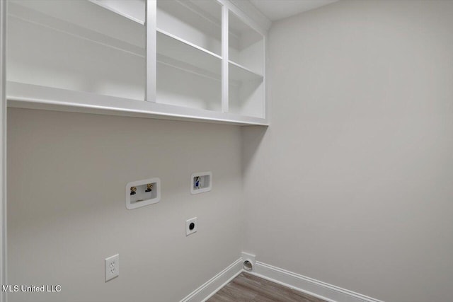 washroom with wood-type flooring, hookup for a washing machine, and electric dryer hookup