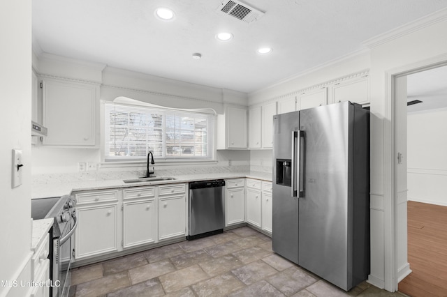 kitchen featuring visible vents, appliances with stainless steel finishes, ornamental molding, extractor fan, and a sink