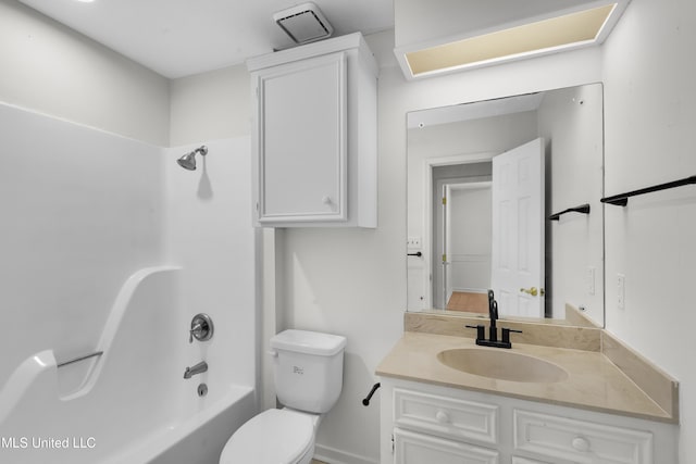 full bathroom featuring bathtub / shower combination, vanity, and toilet