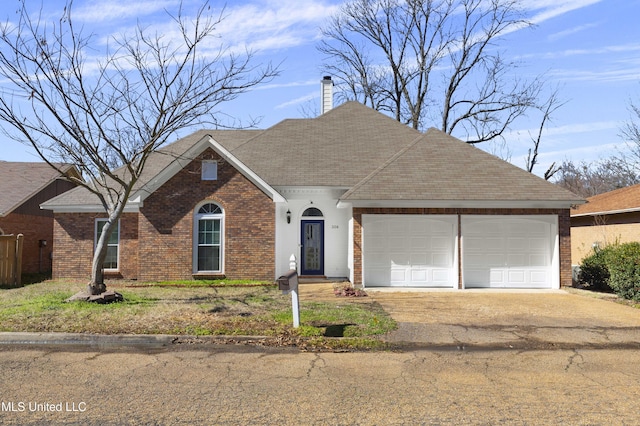 single story home featuring brick siding, a chimney, a shingled roof, a garage, and driveway