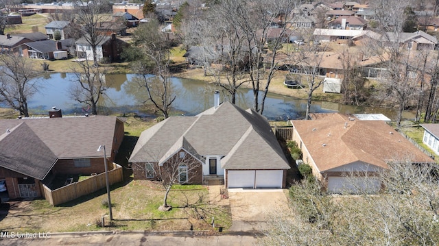 aerial view featuring a water view and a residential view