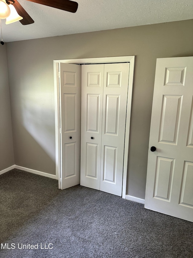 203 Barrow St, Pearl, MS 39208 - unfurnished bedroom with dark colored carpet, a closet, ceiling fan, and baseboards