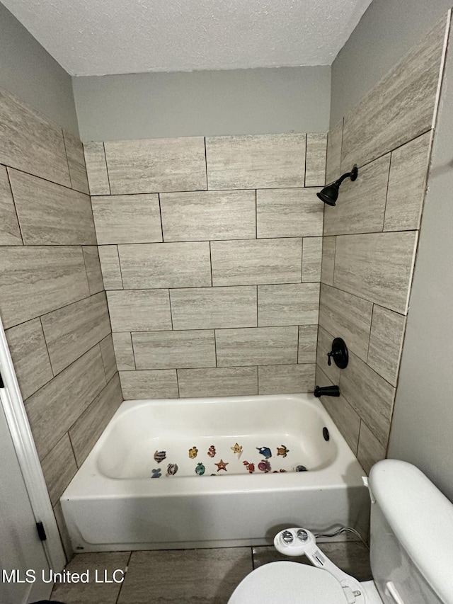 203 Barrow St, Pearl, MS 39208 - bathroom with toilet, a textured ceiling, and bathing tub / shower combination