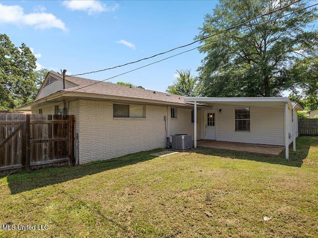 203 Barrow St, Pearl, MS 39208 - back of house with central air condition unit and brick siding