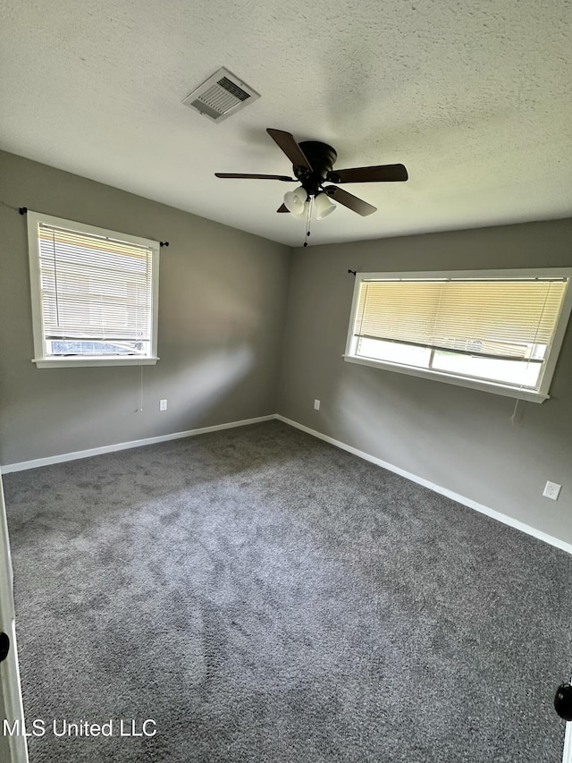 203 Barrow St, Pearl, MS 39208 - empty room featuring baseboards, a ceiling fan, carpet flooring, and a textured ceiling