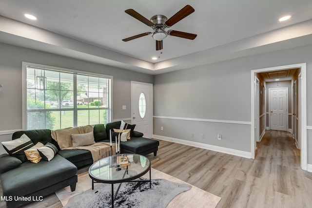 living area featuring attic access, a ceiling fan, light wood-style floors, recessed lighting, and baseboards