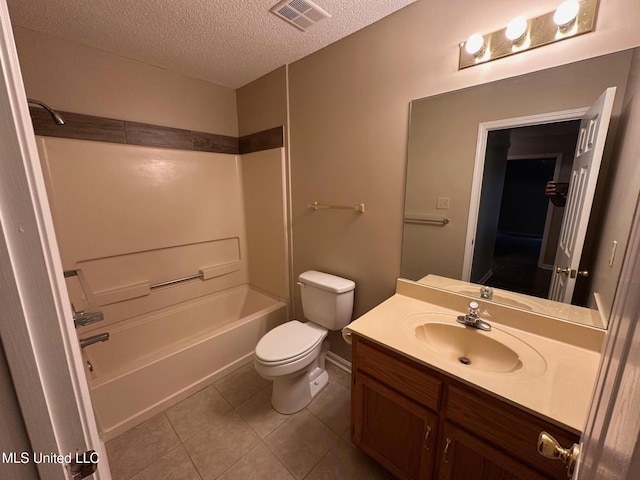 7807 S Chesterfield Dr, Southaven, MS 38671 - full bath with a textured ceiling, vanity, toilet, tile patterned flooring, and shower / tub combination