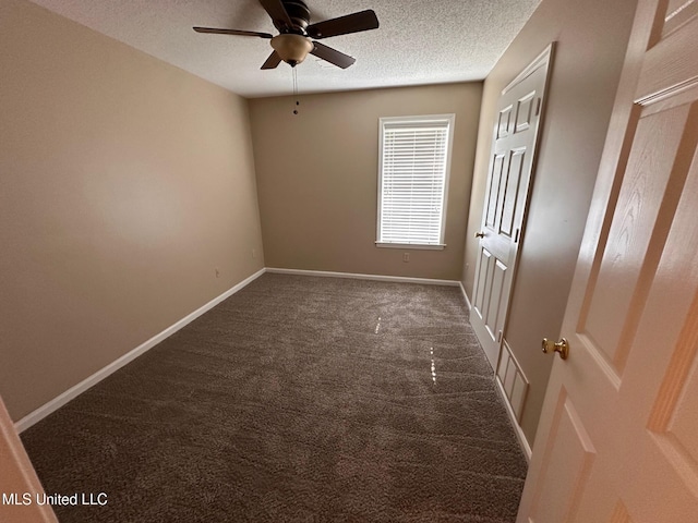 7807 S Chesterfield Dr, Southaven, MS 38671 - spare room featuring dark colored carpet, ceiling fan, a textured ceiling, and baseboards