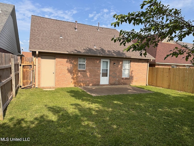 7807 S Chesterfield Dr, Southaven, MS 38671 - rear view of property featuring brick siding, roof with shingles, and a patio area