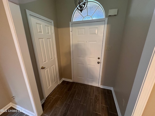 7807 S Chesterfield Dr, Southaven, MS 38671 - foyer entrance with baseboards, dark wood-style flooring, and a chandelier