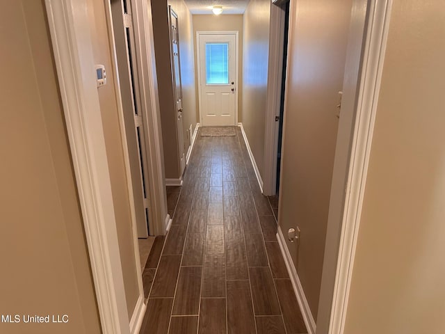 7807 S Chesterfield Dr, Southaven, MS 38671 - hallway with dark wood-style flooring and baseboards