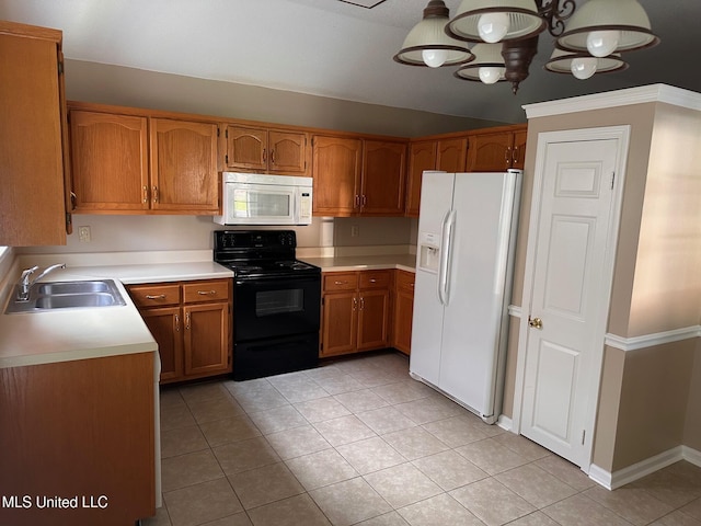 7807 S Chesterfield Dr, Southaven, MS 38671 - kitchen with white appliances, a sink, brown cabinetry, and light tile patterned floors