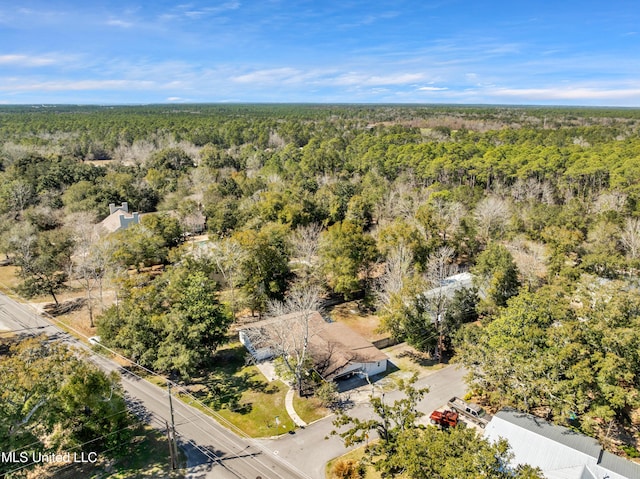 drone / aerial view featuring a forest view