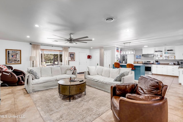 living room featuring light tile patterned floors, a ceiling fan, and recessed lighting