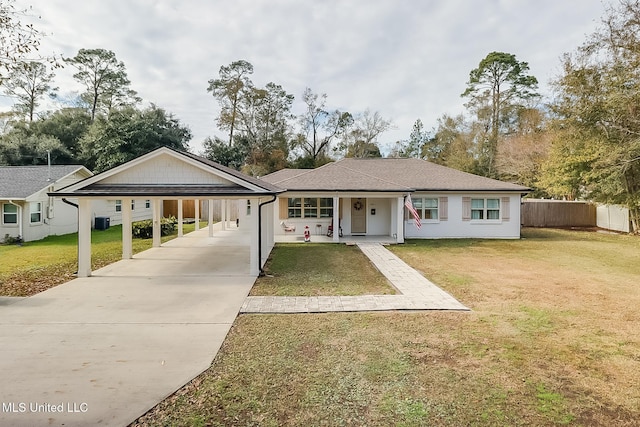 ranch-style home with covered porch, a front yard, central AC unit, and a carport