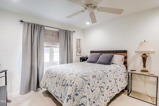 bedroom featuring ceiling fan and light colored carpet