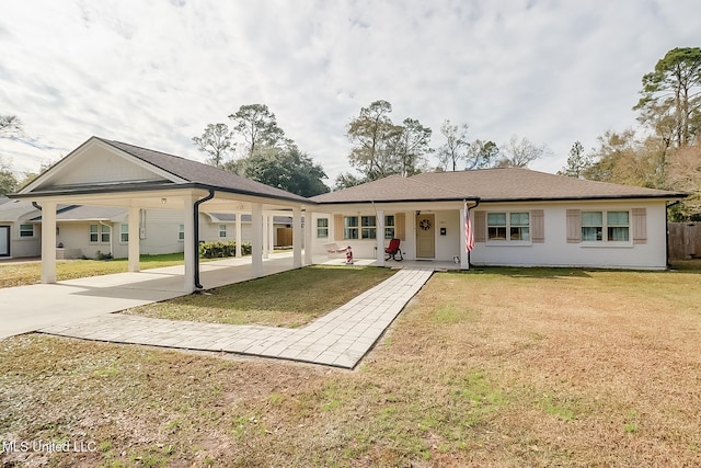 rear view of house featuring a yard and a porch