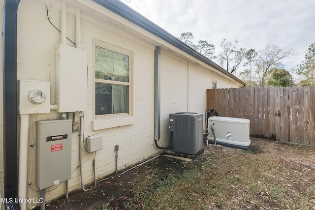 view of property exterior with central AC