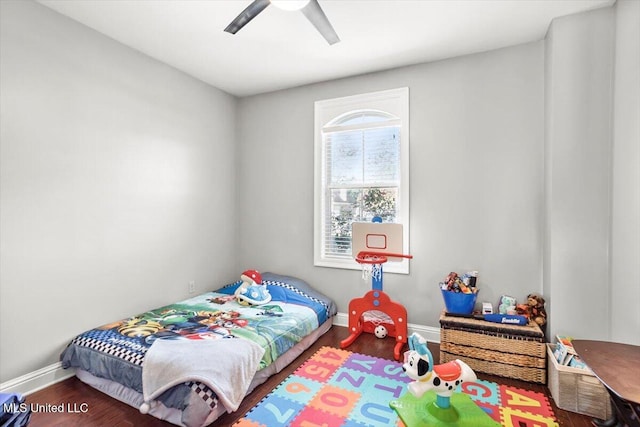 bedroom featuring hardwood / wood-style floors and ceiling fan