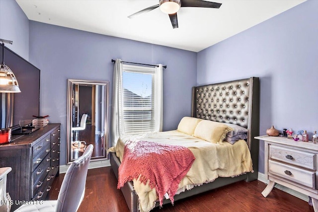 bedroom featuring ceiling fan and dark hardwood / wood-style flooring