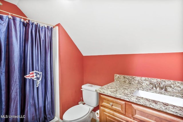 bathroom featuring curtained shower, lofted ceiling, toilet, and vanity