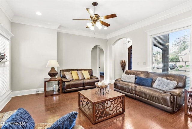 living room featuring ornamental molding, dark hardwood / wood-style flooring, and ceiling fan