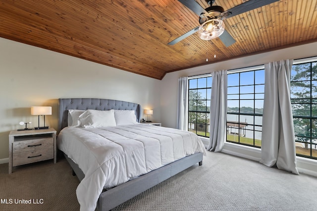 carpeted bedroom with multiple windows, ceiling fan, wooden ceiling, and a water view