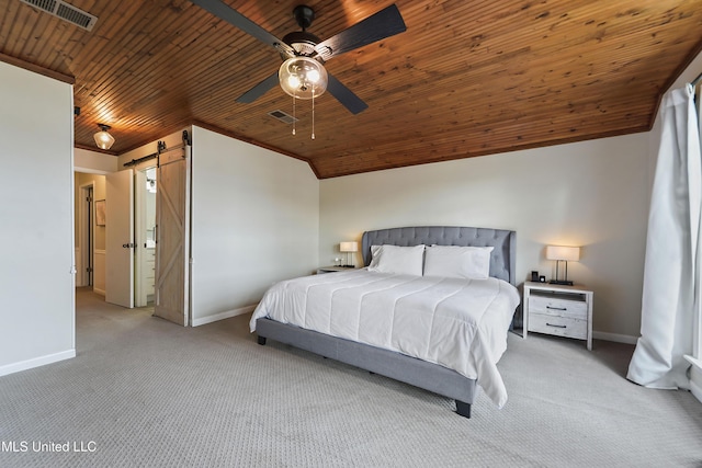 bedroom featuring light carpet, a barn door, ceiling fan, and wood ceiling